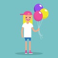 Young blond girl holding a bunch of colourful balloons
