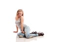 Blond girl with long hair in jeans Royalty Free Stock Photo