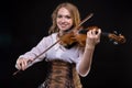 Young blond girl playing the violin Royalty Free Stock Photo