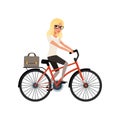 Young blond girl riding bicycle to work in briefcase. Cartoon character of business woman in glasses. Personal transport Royalty Free Stock Photo