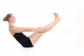 Young blond hair woman in yoga pose Paripurna Navasana or Full boat Pose Royalty Free Stock Photo