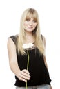 Young blond haired girl gives you a flower Royalty Free Stock Photo