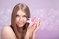 Young blond holding flower