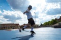 young blond long hair boy performing skateboarding tricks Royalty Free Stock Photo