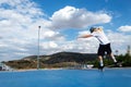 Young blond long hair boy performing skateboarding tricks in the skatepark Royalty Free Stock Photo