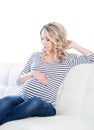 Young blond pregnant woman in a striped shirt Royalty Free Stock Photo