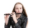 Young blond teen girl and piccolo flute in studio against white background Royalty Free Stock Photo