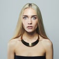 Young blond woman.Beautiful Girl.blonde in necklace Royalty Free Stock Photo