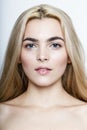 Closeup front portrait of a young blond woman. Beautiful Girl with makeup. Royalty Free Stock Photo