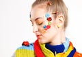 Young blond woman with creativity hairstyle with colored buttons