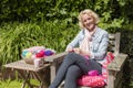 Young Blond Woman Crochets Royalty Free Stock Photo