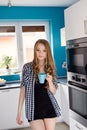 Young blond woman drinking coffe or tea from the cup Royalty Free Stock Photo