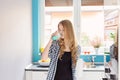 Young blond woman drinking milk from the glass. Royalty Free Stock Photo