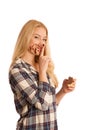 Young blond woman eating breakfast bread and nougat spread isolated over white background Royalty Free Stock Photo