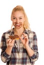 Young blond woman eating breakfast bread and nougat spread isolated over white background Royalty Free Stock Photo