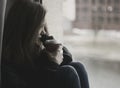 Thoughtful woman looking out window