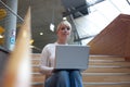 Young blond woman with laptop Royalty Free Stock Photo