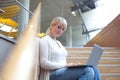 Young blond woman with laptop Royalty Free Stock Photo