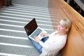 Young blond woman with laptop Royalty Free Stock Photo