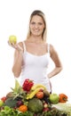 A young blond woman and a pile of fresh fruits Royalty Free Stock Photo