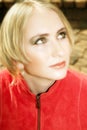 Young blond woman in red jacket Royalty Free Stock Photo