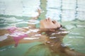 Young blond woman relaxing in the water Royalty Free Stock Photo