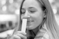 Young blond woman savoring an aroma