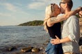 Young Blond Woman Smooching Boyfriend At Beach Royalty Free Stock Photo