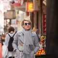 Young blond woman with sunglases on the street Royalty Free Stock Photo