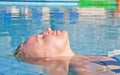 Young blond woman in swimming pool Royalty Free Stock Photo