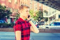 Young blonde American Man talking on cell phone outside in New York City Royalty Free Stock Photo