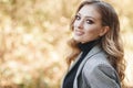 Young blonde beautiful woman spends time alone on a sunny day in a city park Royalty Free Stock Photo