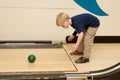 Child bowling with ball Royalty Free Stock Photo