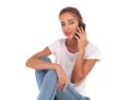 Young blonde casual woman talking on the phone Royalty Free Stock Photo