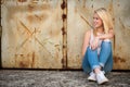 Young blonde caucasian girl alone on a street