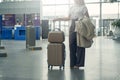 Young blonde female waiting for her flight Royalty Free Stock Photo