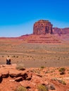 Young blonde girl admires panorama from Artist`s Point in Oljato Monument Valley Royalty Free Stock Photo