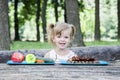 Young blonde girl choosing food for her meal Royalty Free Stock Photo