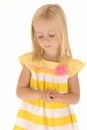 Young blonde girl hands folded eyes closed praying innocent