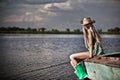 Young blonde girl on lake Royalty Free Stock Photo
