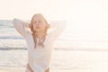 Young Blonde Girl Relaxing on the Beach in the Sun Royalty Free Stock Photo