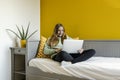 Young girl using laptop on her bed Royalty Free Stock Photo