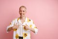 Young blonde laughing man pointing fingers at himself Royalty Free Stock Photo