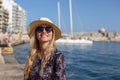 Young blonde Mediterranean traveler woman portrait at sea