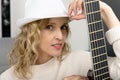 Young blonde woman with the acoustic guitar Royalty Free Stock Photo