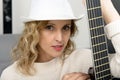 Young blonde woman with the acoustic guitar Royalty Free Stock Photo