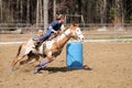 Young blonde woman barrel racing Royalty Free Stock Photo