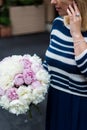 Young blonde woman in blue dress with peonies bouquet Royalty Free Stock Photo