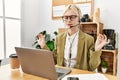 Young blonde woman business worker doing yoga exercise at office Royalty Free Stock Photo