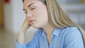 Young blonde woman business worker sleeping at office Royalty Free Stock Photo